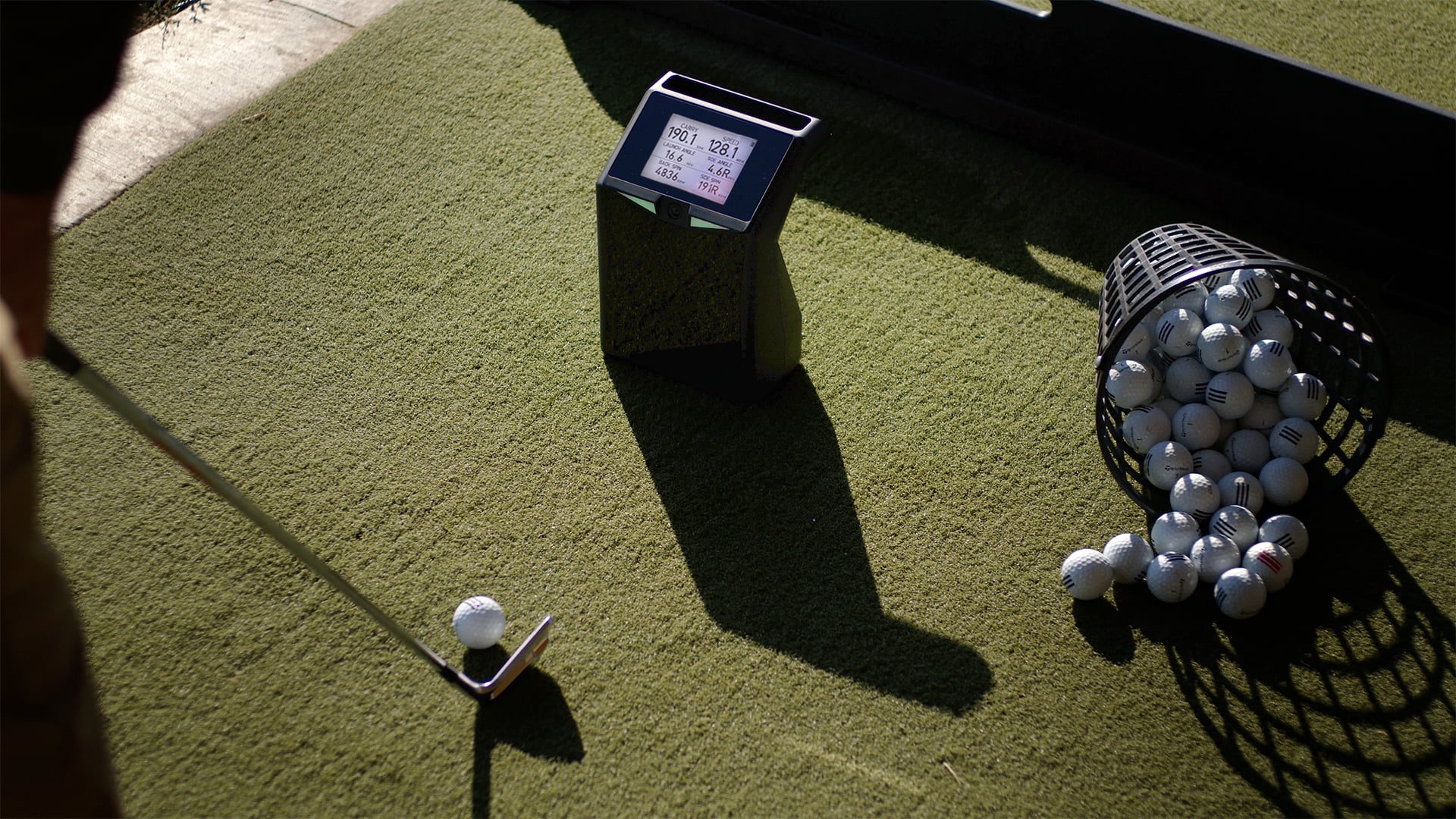 TruGolf LaunchBox at a practice range with range balls