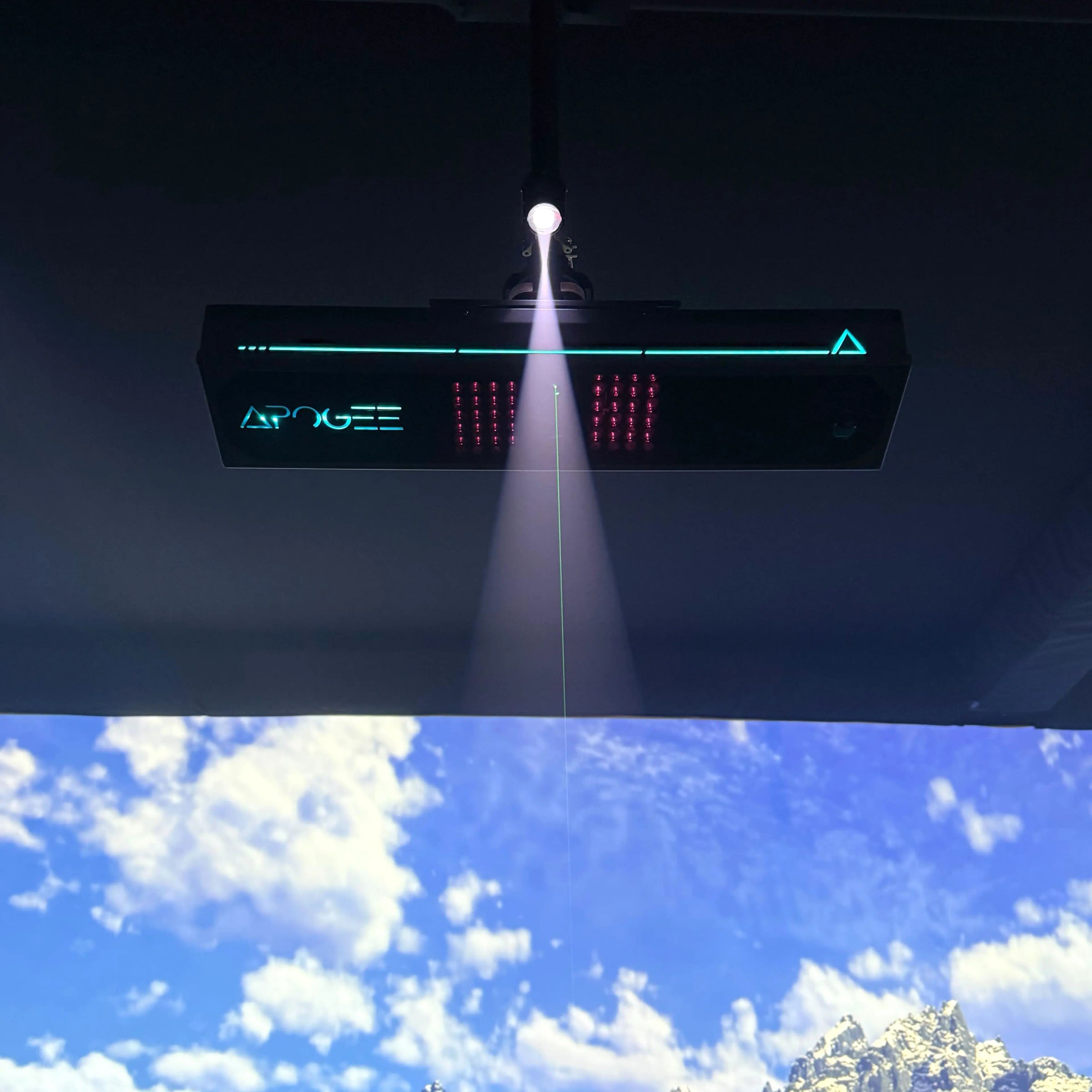TruGolf Apogee mounted above a simulator screen